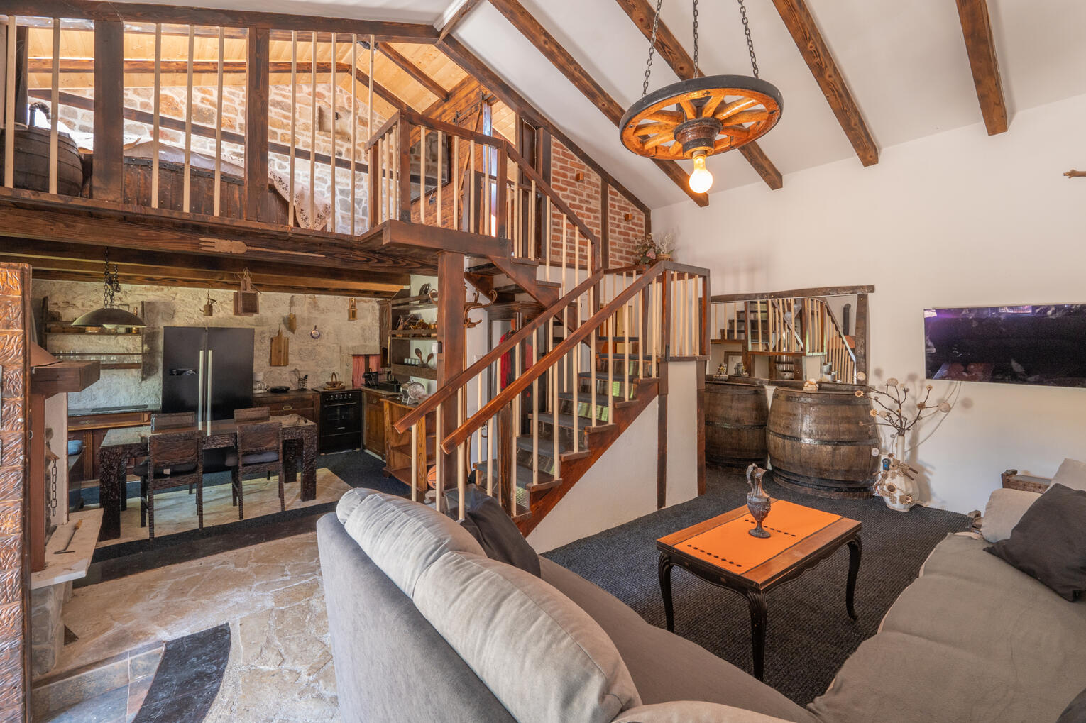 Living room, kitchen and stairwell towards bedrooms