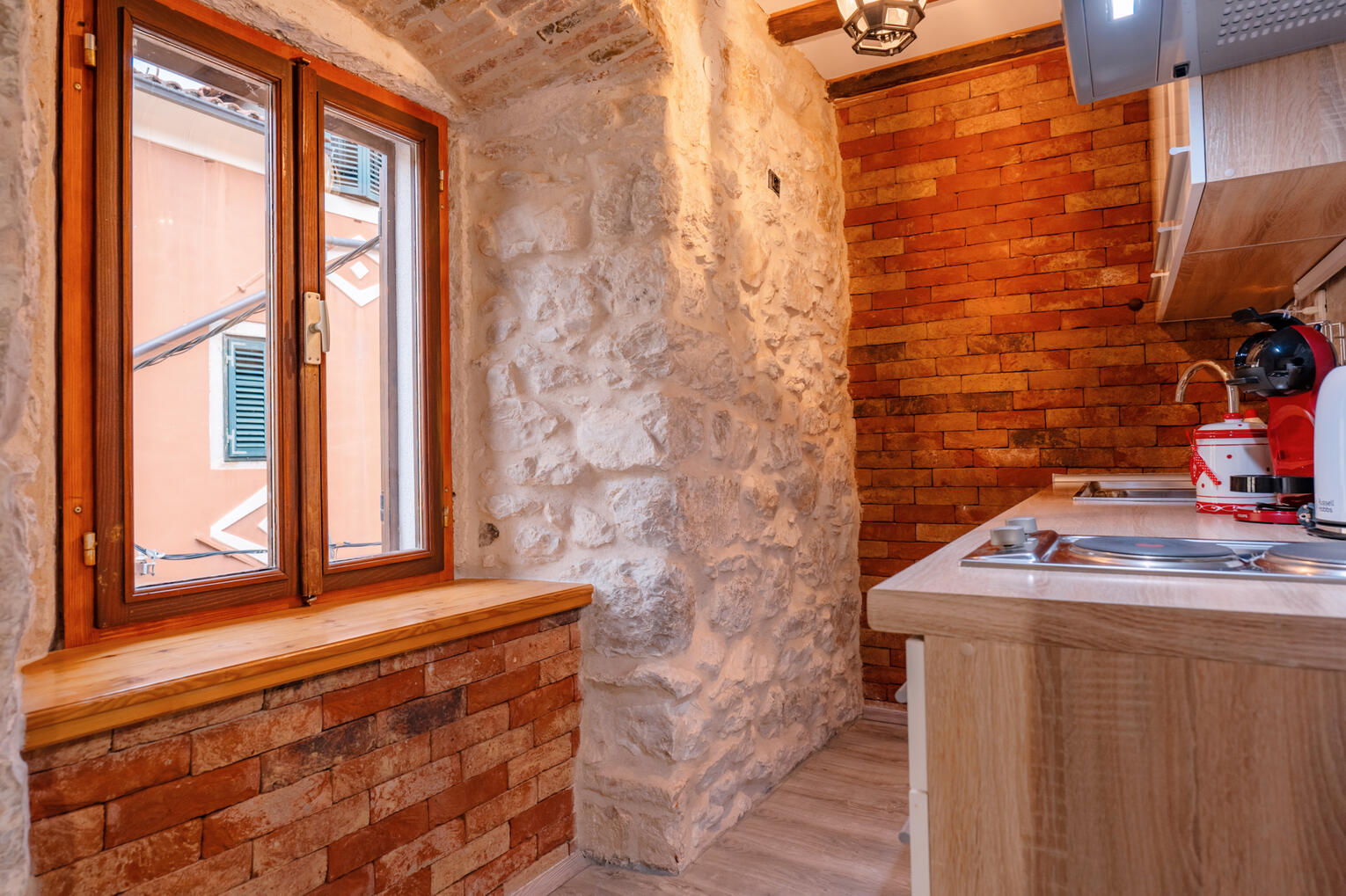 Kitchen with natural stone wall