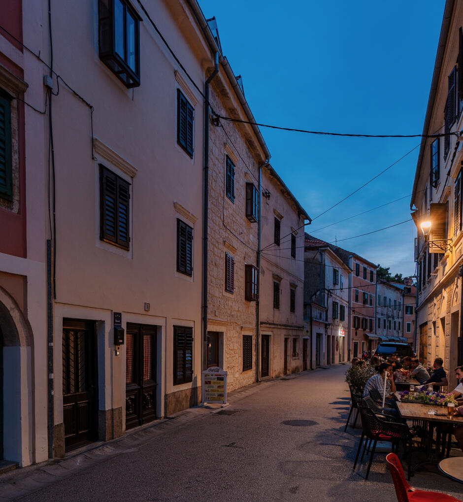Old town street, in the center highlighting the position of the traditional Rustika stone house